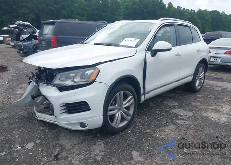 2014 Volkswagen Touareg 3.6L Executive z USA, uszkodzony, nr VIN WVGEF9BP0ED008047